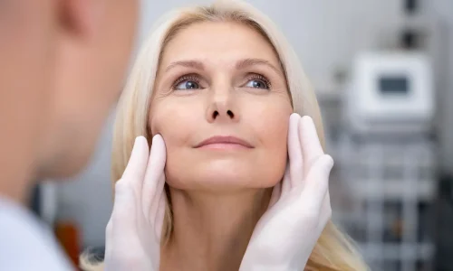 close-up-doctor-checking-smiley-woman-scaled